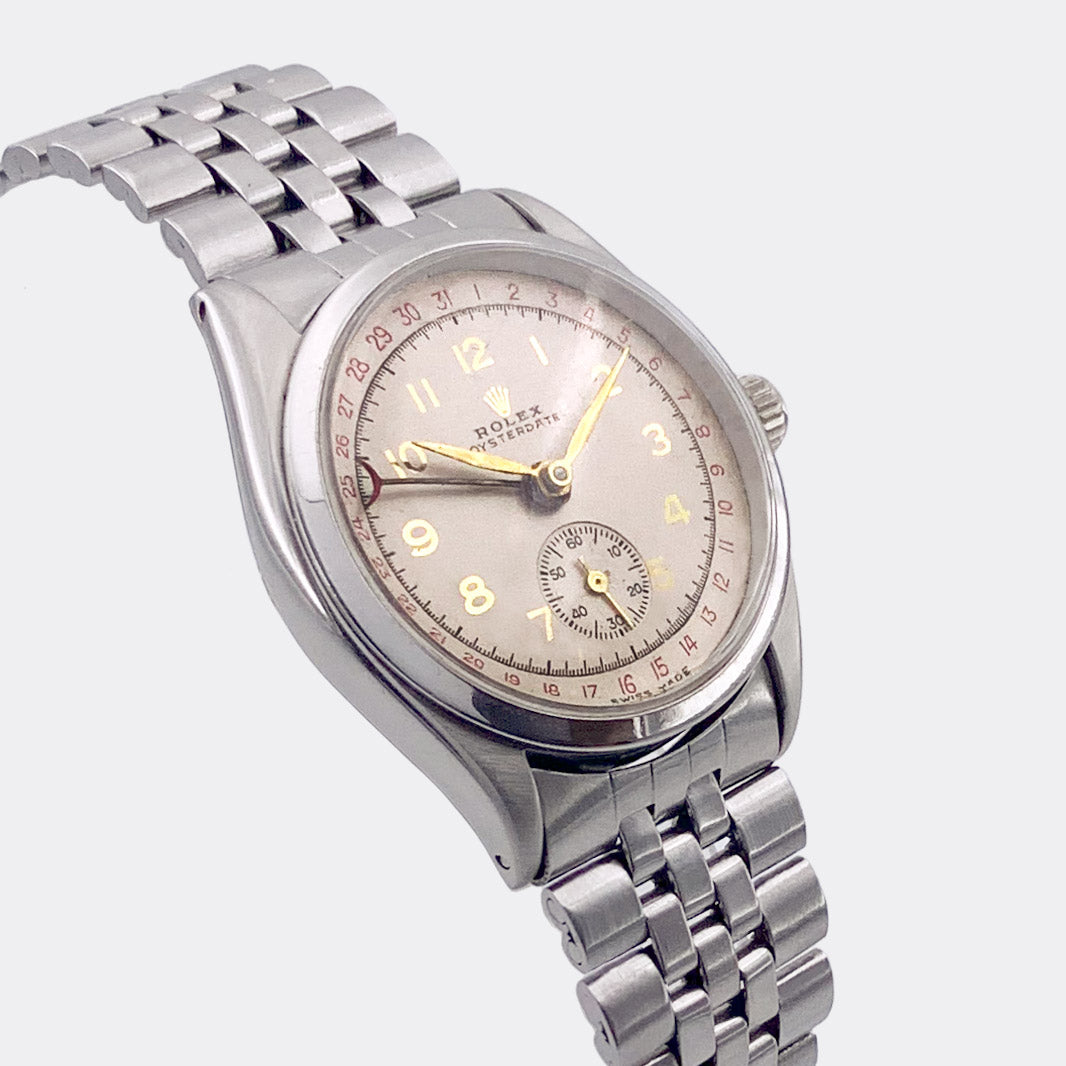 ROLEX | One-of-a-Kind | Oysterdate | Red Date Outer Ring | Subseconds | 18K | Multicolor Cream Dial | Ref. 6294 | 1950s